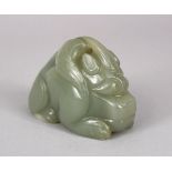A CHINESE CARVED CELADON JADE FIGURE OF A MYTHICAL BEAST OR DRAGON, 8CM