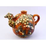A LARGE CHINESE SANCAI GLAZED TANG STYLE POTTERY EWER, with carved and moulded decoration of a