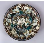 A GOOD PERSIAN SAFAVID DYNASTY KUBACHI POTTERY DISH, the dish with two ducks seated amongst an array