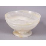 A 19TH CENTURY CHINESE CARVED WHITE AGATE STEM BOWL, 10cm.