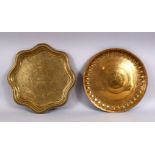 TWO GOOD 18TH / 19TH CENTURY PERSIAN / ISLAMIC BRASS DISHES, one with floral motif and moulded