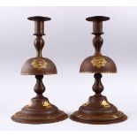 A FINE PAIR OF QAJAR STEEL AND GOLD INLAID CANDLESTICKS, the inlay of calligraphy and the qajar