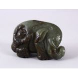 A GOOD 19TH CENTURY CHINESE CARVED JADE BOY & ELEPHANT FIGURE, the boy stood climbing upon or
