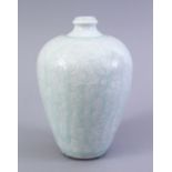 A GOOD SOUTH SONG STYLE CARVED CELADON MEIPING VASE, the body carved with scrolling floral design,