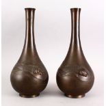 A GOOD PAIR OF JAPANESE MEIJI PERIOD BRONZE RELIEF CARP VASES, the body of both bottle shaped