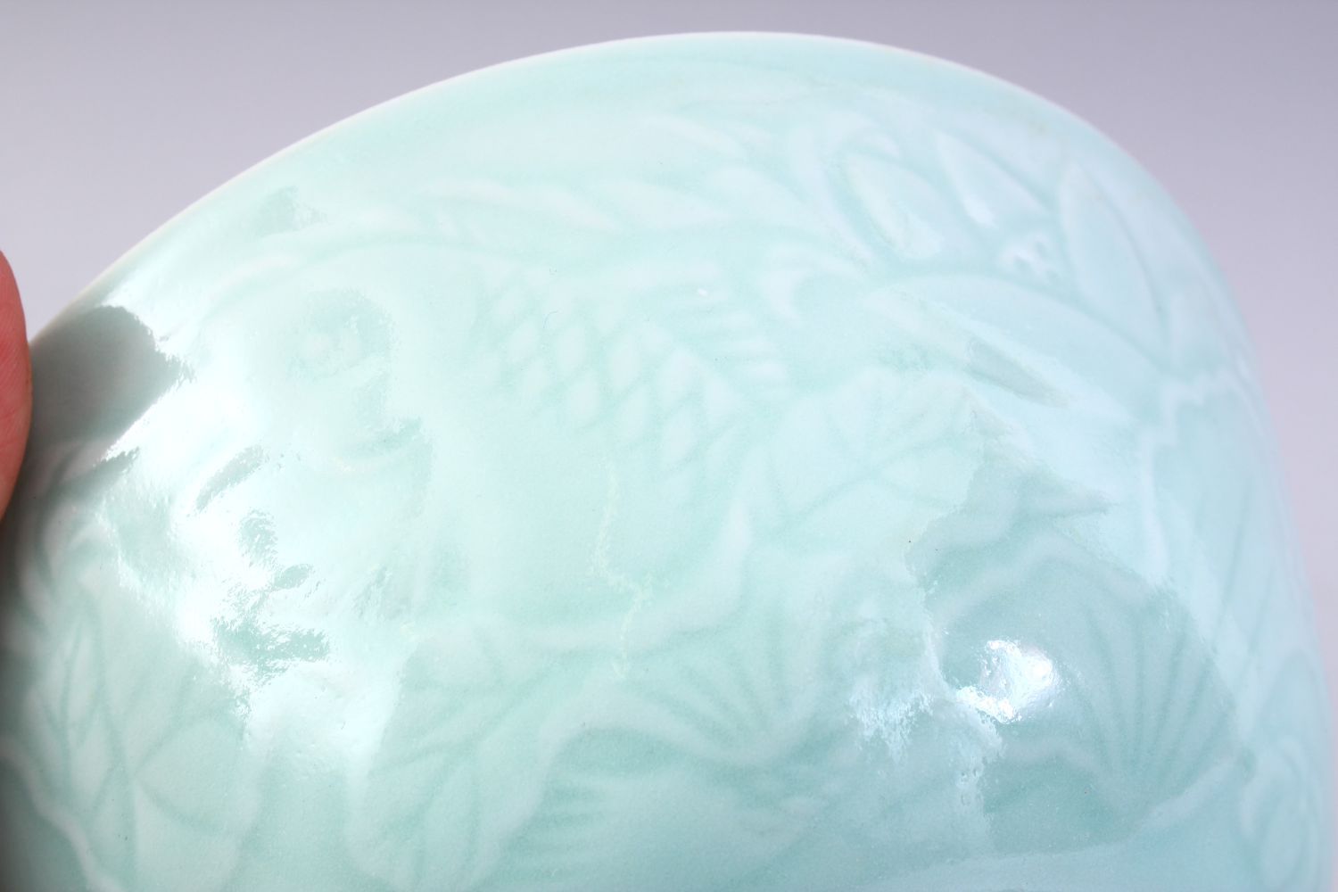 A CHINESE CELADON MOULDED PORCELAIN CARP BOWL, the bowl with carved decoration of fish and lotus, - Image 5 of 8