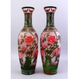 A GOOD PAIR OF 20TH CENTURY CHINESE PEKING GLASS VASES, the vases overlaid with decoration of