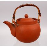 A GOOD CHINESE YIXING CLAY TEAPOT, with carved decoration of landscapes, the base signed, 15cm