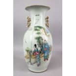 A CHINESE REPUBLIC STYLE FAMILLE ROSE PORCELAIN TWIN HANDLE VASE, decorated with figures in a