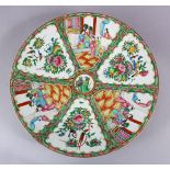 A GOOD 19TH CENTURY CHINESE CANTON FAMILLE ROSE PORCELAIN CHARGER, with panel decoration of