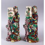 A PAIR OF JAPANESE MEIJI PERIOD KUTANI PORCELAIN CANDLE STICK FIGURES, in the form of two figures