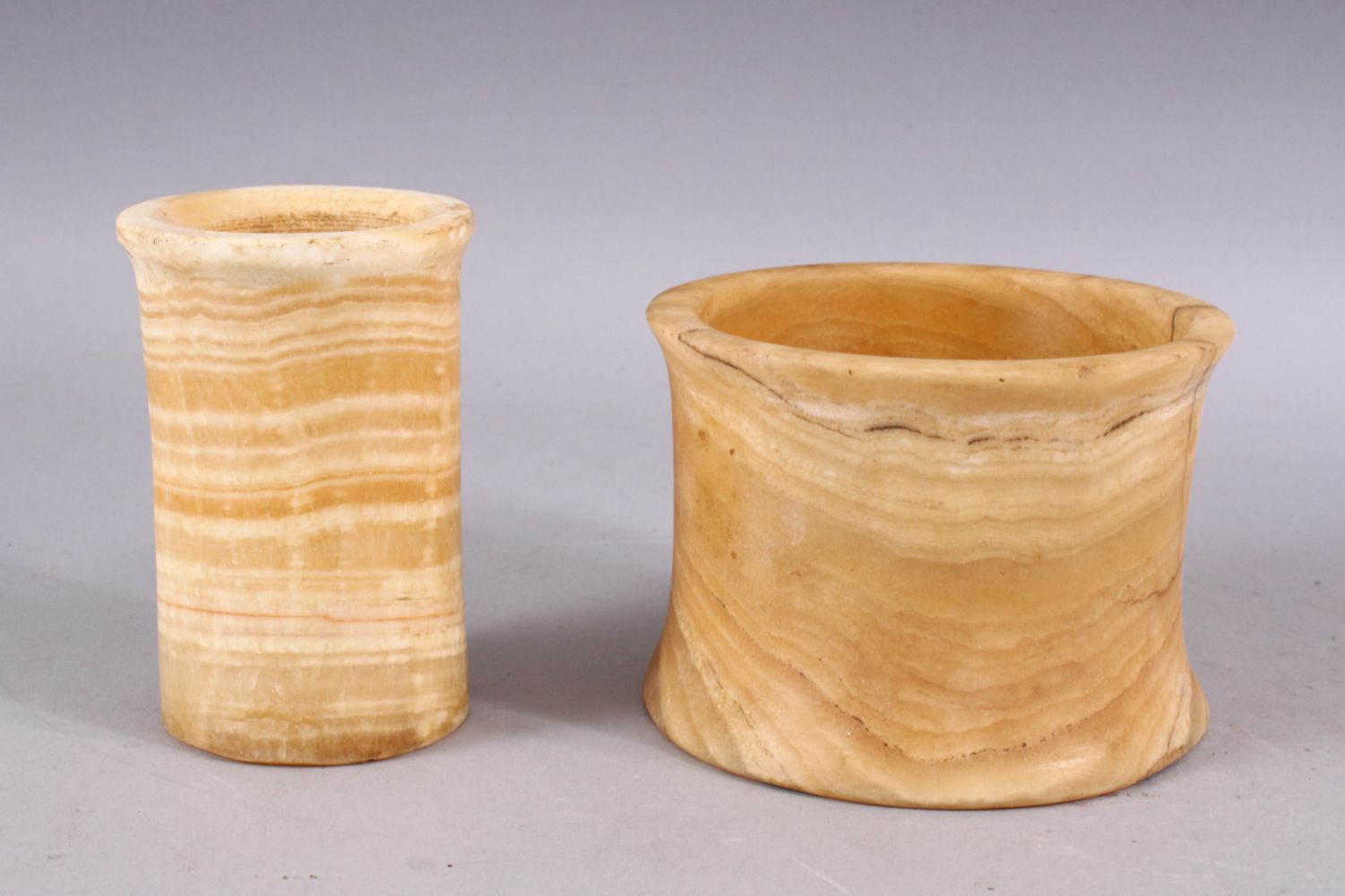 A GOOD CARVED ALABASTER CYLINDRICAL CUP AND BOWL, 12CM HIGH & 10CM, 14CM diameter and 8CM.
