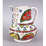 A 19TH CENTURY TURKISH KUTAHYA POTTERY JUG, with floral motif decoration,15cm high.