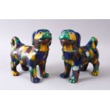 A GOOD PAIR OF 19TH / 20TH CENTURY SANCAI PORCELAIN DOGS, with egg and spinach coloured