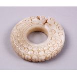 A GOOD CHINESE CARVED WHITE JADE PHOENIX BI DISK PENDANT, carved with chilong, 6cm.