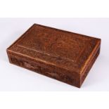 A GOOD 19TH / 20TH CENTURY INDIAN CARVED WOODEN LIDDED BOX, 31cm x 20cm.