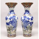 A LARGE PAIR OF JAPANESE MEIJI PERIOD BLUE AND WHITE PORCELAIN IMARI VASES, the body of the vases