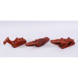 THREE 19TH CENTURY TURKISH TOPHANE POTTERY BATH RASPS, in the form of two alligators20cm, 20cm &