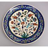 A GOOD LARGE IZNIK POTTERY DISH, decorated with floral decoration. 38cm.
