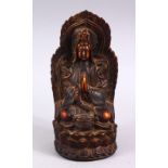 A GOOD CHINESE CARVED IVORY STYLE FIGURE OF SEATED GUANYIN, seated upon a lotus base, with her hands