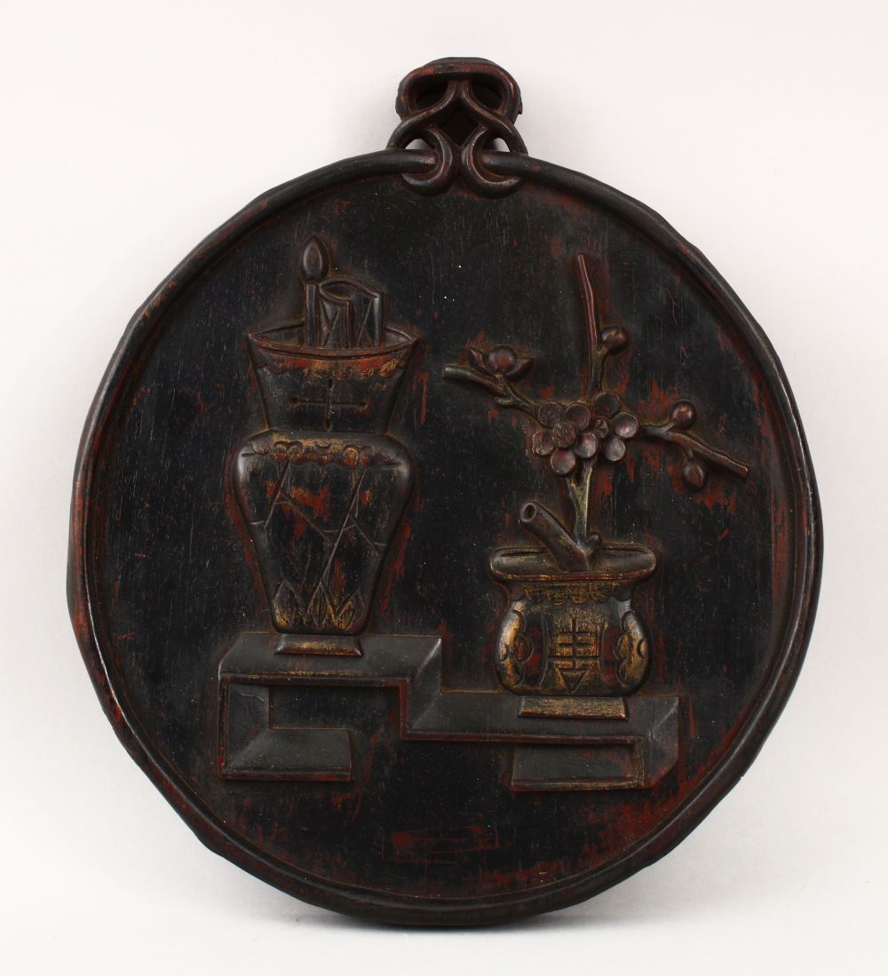 A GOOD CHINESE CARVED HARDWOOD FLORAL DISPLAY PANEL, depicting two displays of native flora, 29cm