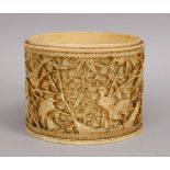 A 19TH CENTURY JAPANESE CARVED IVORY TUSK SECTION, depicting cranes and cherry blossom, 8cm.