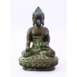 A GOOD EARLY 17TH / 18TH CENTURY TIBETAN BRONZE FIGURE OF BUDDHA, in a seated position holding a