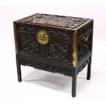 A GOOD 19TH CENTURY CHINESE CARVED HARDWOOD / HONGMU DRAGON CARVED LIDDED CHEST, the panels of the