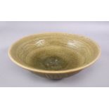 A VERY GOOD CHINESE MING DYNASTY CELADON PEONY DISH / BOWL, with a crackle glaze and carved peony