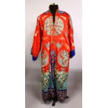 A FINE 19TH CENTURY CHINESE EMBROIDERED SILK DRAGON COURT ROBE, the silk of red ground with