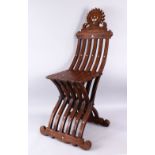 A GOOD 19TH CENTURY CARVED WOODEN ISLAMIC FOLDING CHAIR, inlaid with mother of pearl, 113cm high.