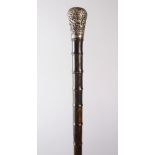 AN UNUSUAL 19TH CENTURY INDIAN SECTIONAL RHINO HORN WALKING STICK, WITH SILVER TOP, 85cm.