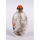 A CHINESE REVERSE PAINTED GLASS SNUFF BOTTLE, depicting birds amongst flora, with a hard stone