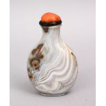 A FINE 19TH / 20TH CENTURY CHINESE CARVED AGATE SNUFF BOTTLE, with a coral stopper, 8cm.