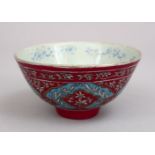 A GOOD 19TH CENTURY QAJAR FAMILLE ROSE PORCELAIN BOWL, with a pink ground and turquoise border