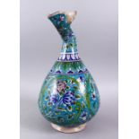 A GOOD 19TH CENTURY PERSIAN TURQUOISE AND BLUE POTTERY VASE, with a open spill neck, and floral