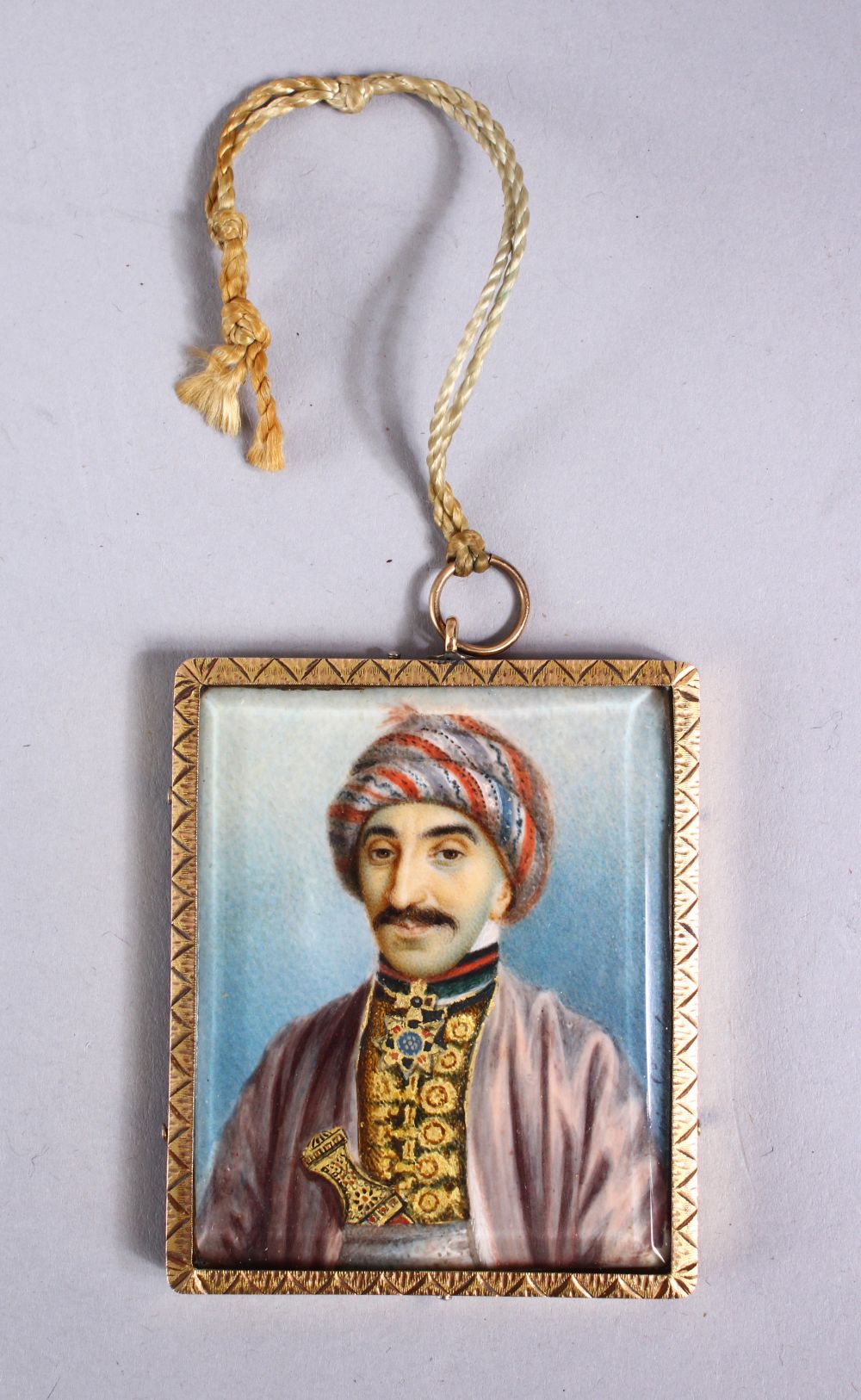 A 19TH CENTURY PERSIAN MINIATURE PAINTING ON MICA? WITH GILT METAL FRAME - SIGNED, possibly gold but