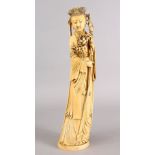 A GOOD 19TH CENTURY CHINESE CARVED IVORY FIGURE OF GUANYIN, stood holding her staff and floral