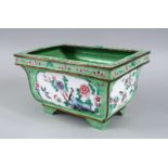 A GOOD 19TH / 20TH CENTURY CHINESE APPLE GREEN ENAMELLED PLANTER, decorated with panels depicting