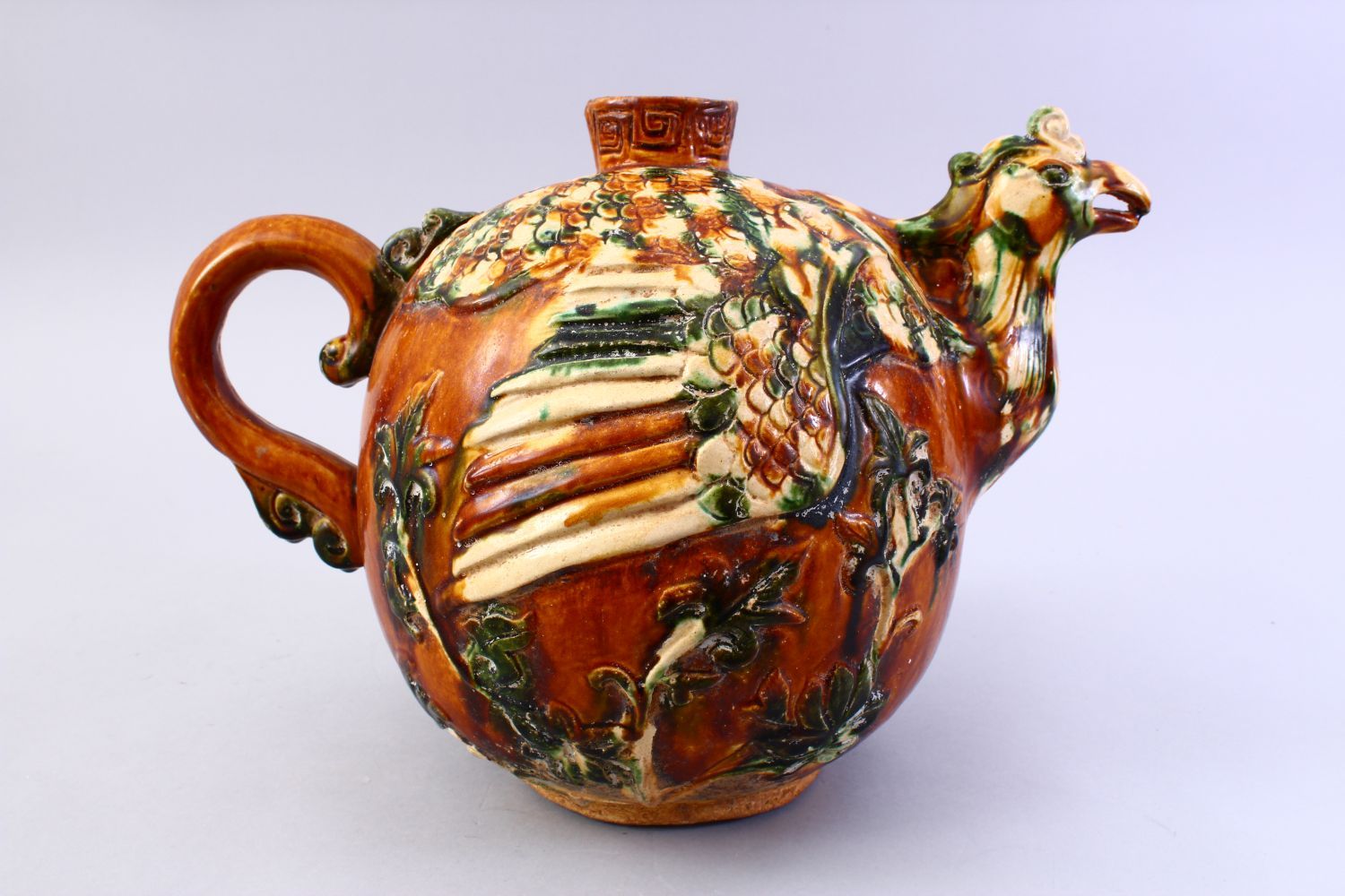 A LARGE CHINESE SANCAI GLAZED TANG STYLE POTTERY EWER, with carved and moulded decoration of a - Image 4 of 8