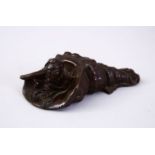 A GOOD JAPANESE BRONZE OKIMONO OF A BOY AND CONCH SHELL, base signed. 9cm.