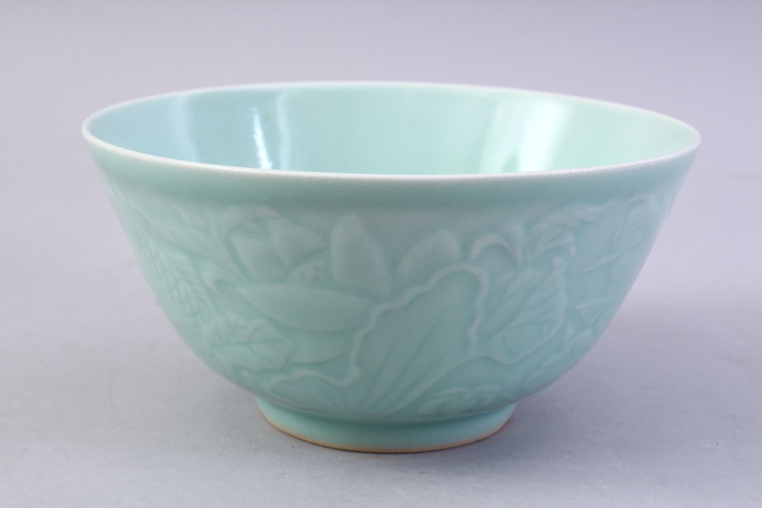 A CHINESE CELADON MOULDED PORCELAIN CARP BOWL, the bowl with carved decoration of fish and lotus, - Image 2 of 8