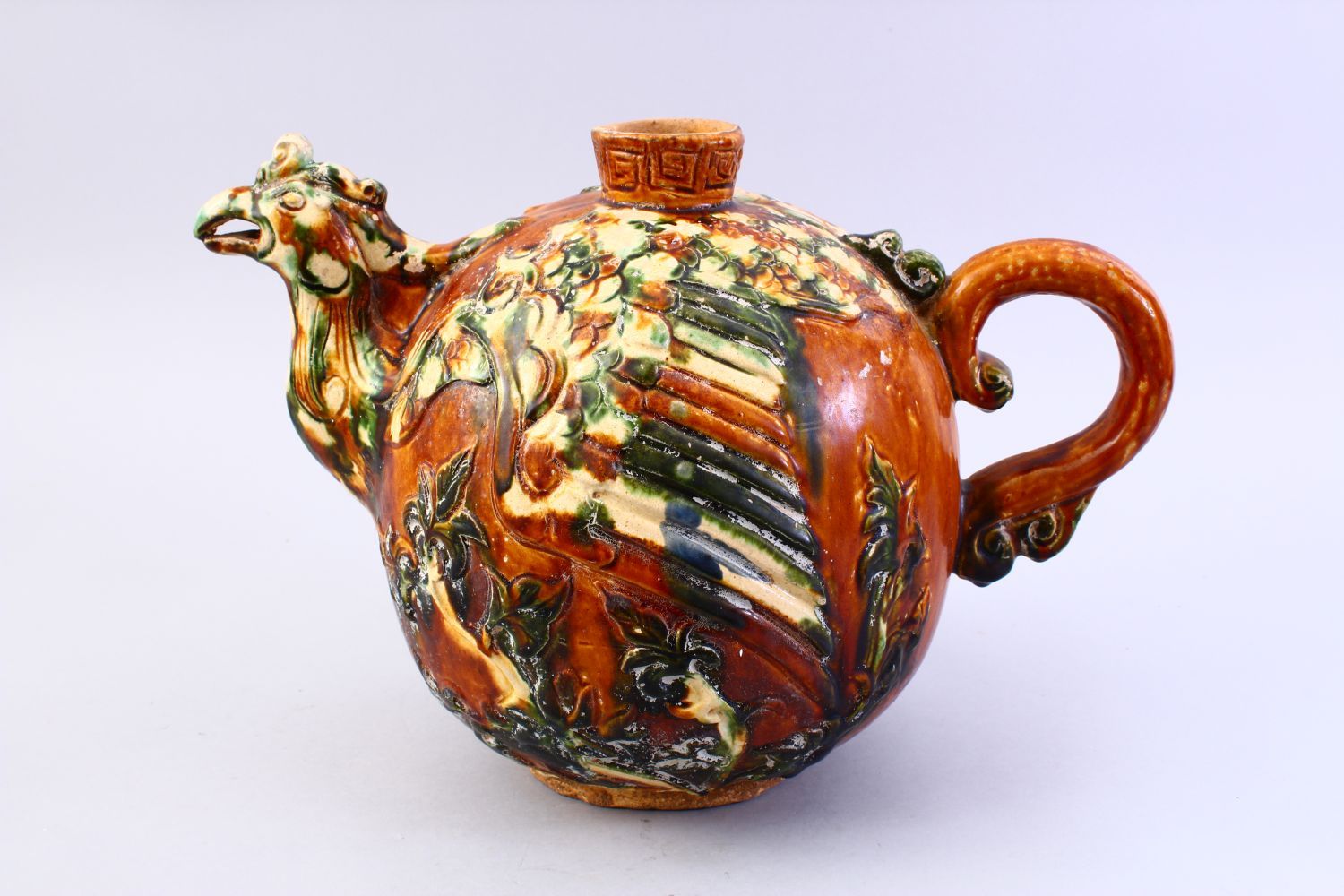 A LARGE CHINESE SANCAI GLAZED TANG STYLE POTTERY EWER, with carved and moulded decoration of a - Image 2 of 8