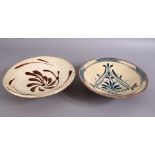 TWO 19TH CENTURY TURKISH CANAKKALE POTTERY BOWLS, decorated with stylized flora, 20cm & 21cm.