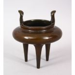 A GOOD CHINESE LONG FOOT BRONZE TWIN HANDLE CENSER, the base with a impressed four character mark,