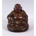 A CHINESE BRONZER C AST FIGURE OF BUDDHA HOLDING A PEACH, seated upon a lotus base. 17cm high.