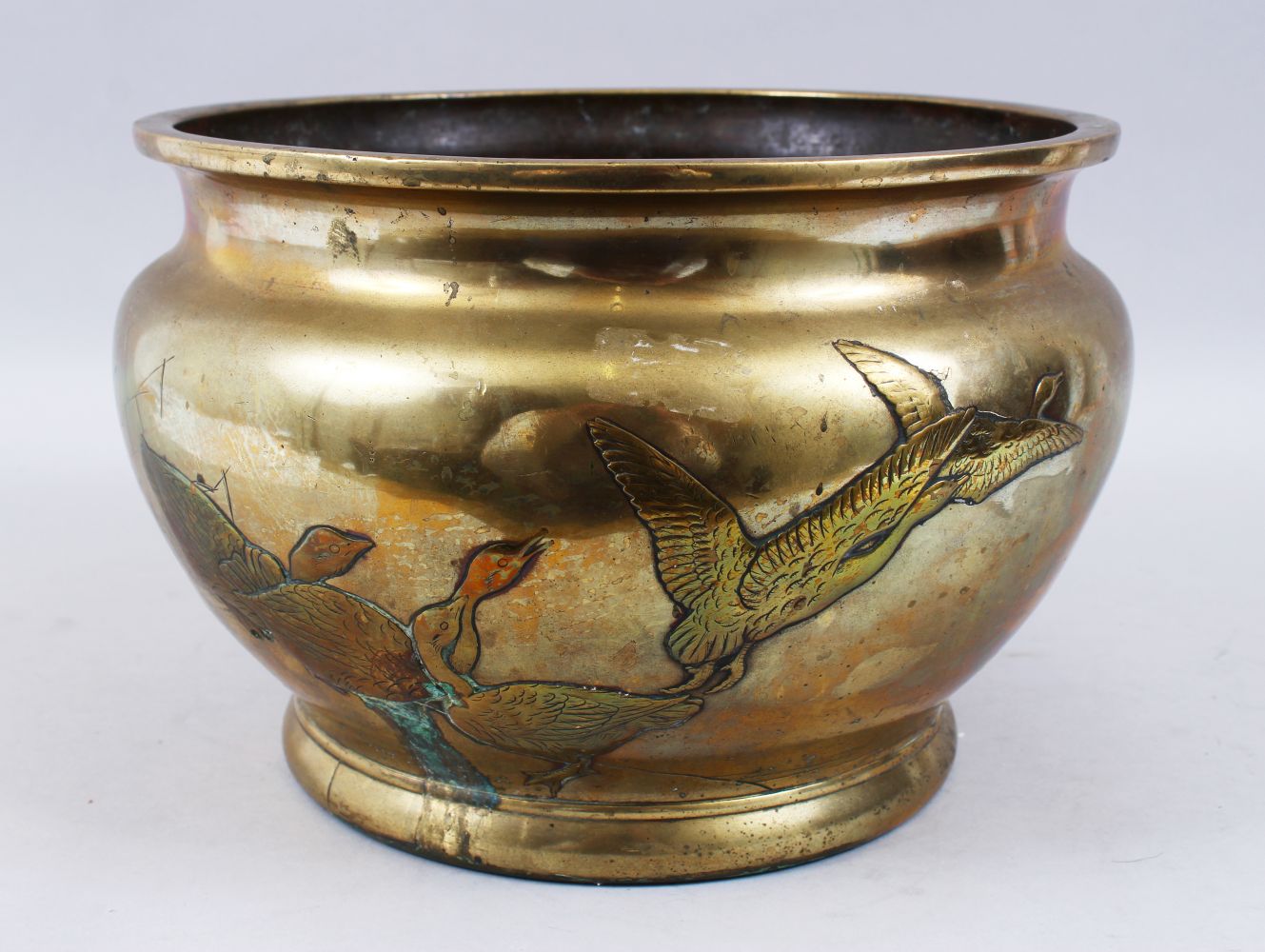 A LARGE JAPANESE MEIJI PERIOD BRONZE GEESE JARDINIERE, the body of the jardiniere with carved