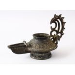 AN EARLY ISLAMIC POSSIBLY ANDALUSIAN SPANISH BRONZE OIL LAMP, 16CM