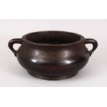 A CHINESE MING STYLE BRONZE TWIN HANDLES CENSER, the base with an impressed mark, 22cm.