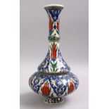 AN ISLAMIC PALESTINIAN POTTERY WATER URN, decorated with floral decoration, 31cm